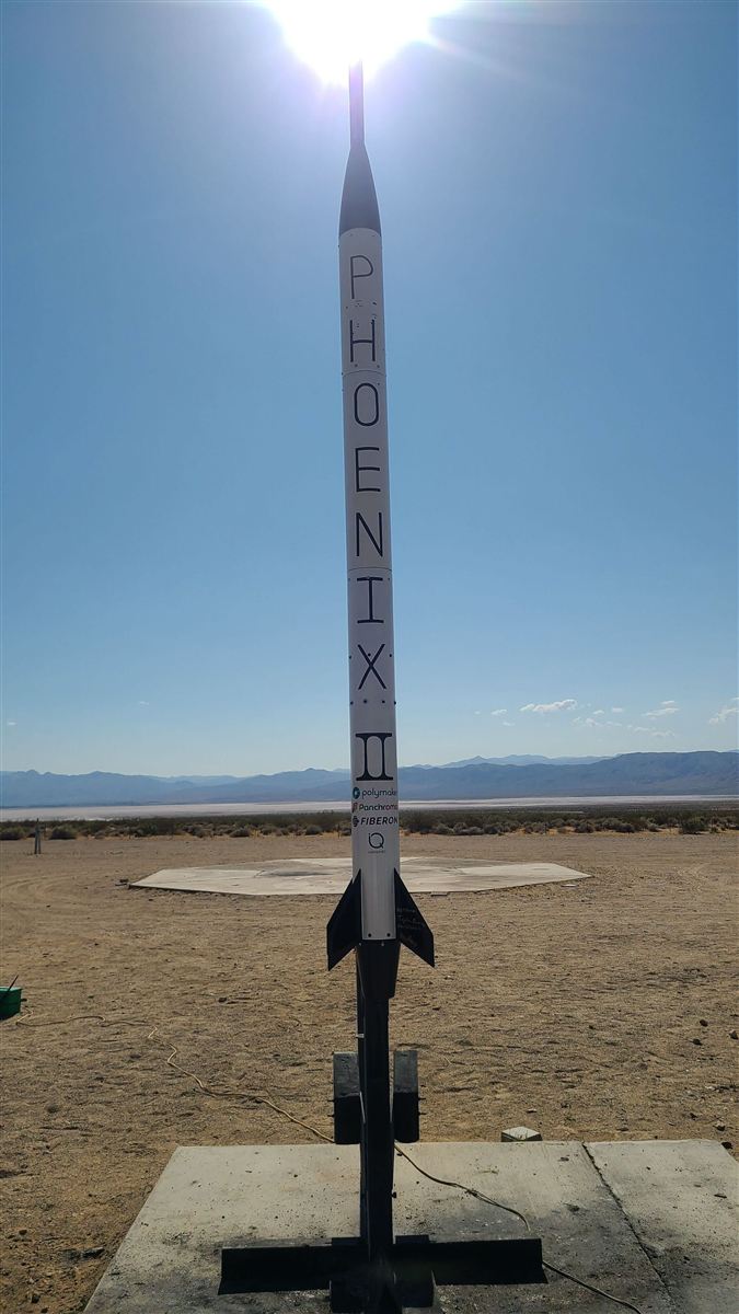 phoenix ii standing on the launch pad in the desert